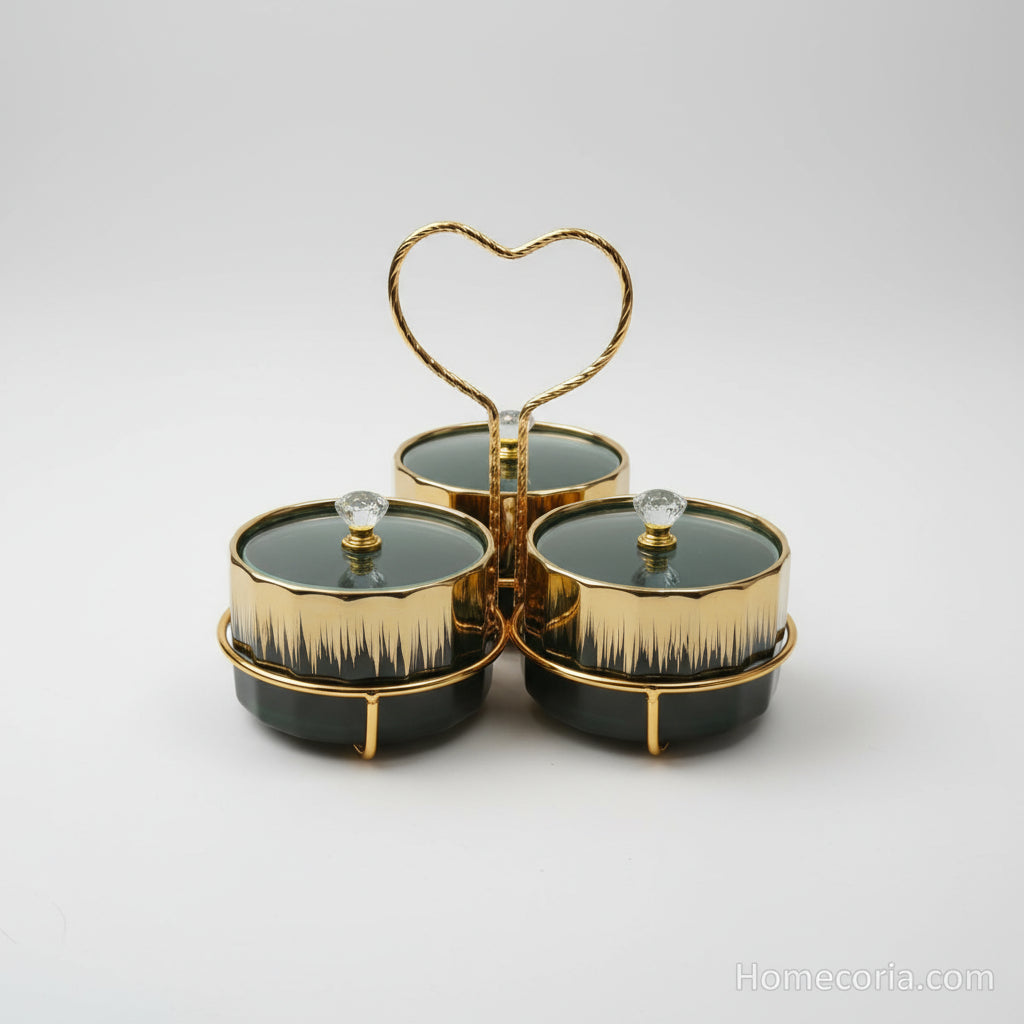 Ceramic canister set with gold embellishments in front of a packaging box.