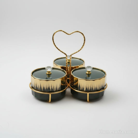 Ceramic canister set with gold embellishments in front of a packaging box.